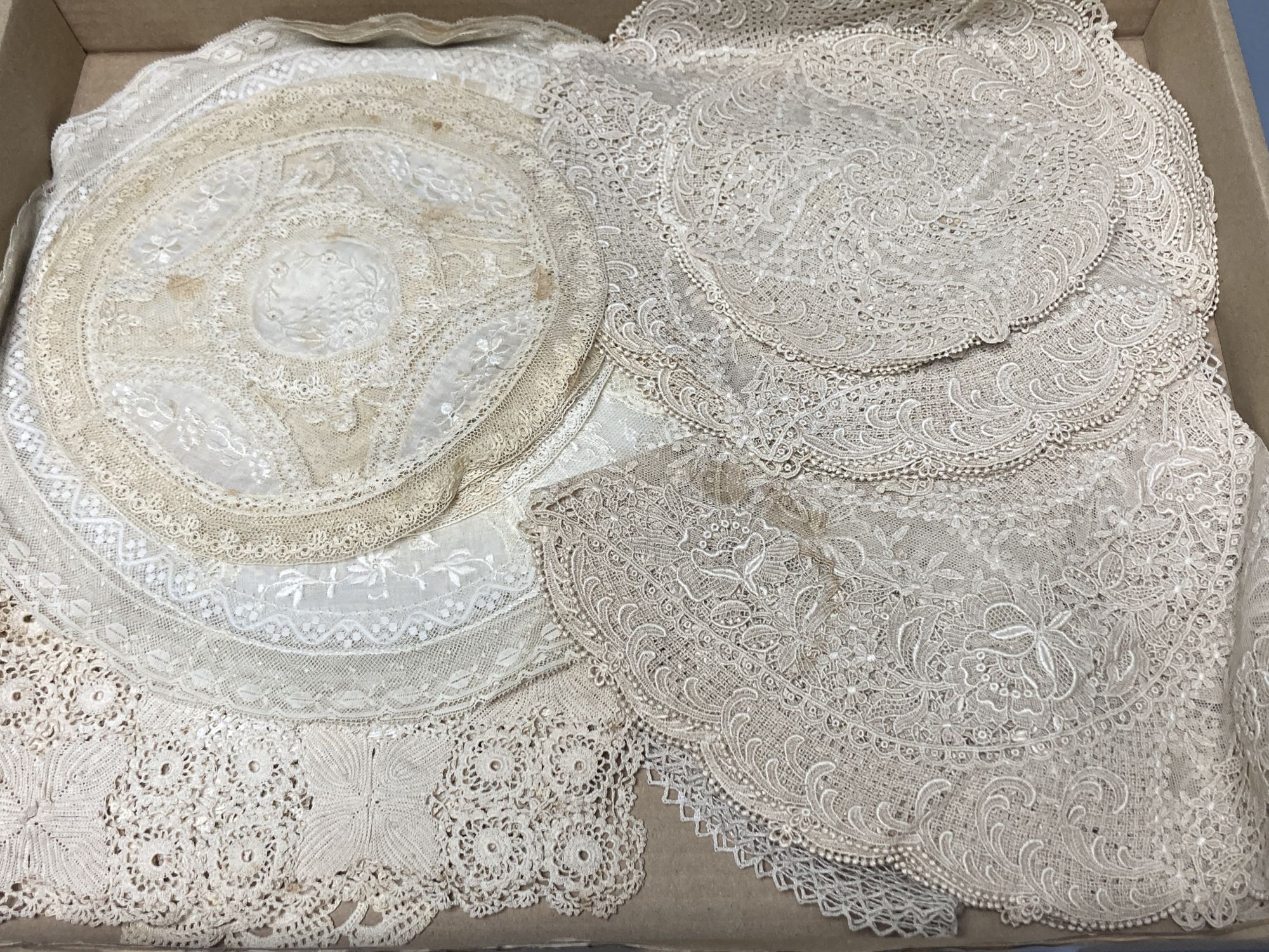 A set of Normandy lace table mats and assorted mats